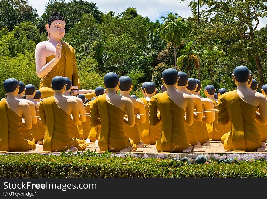 Buddha image and monk statues