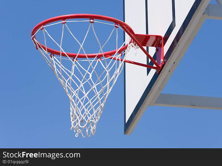 Basketball hoop over a blue sky
