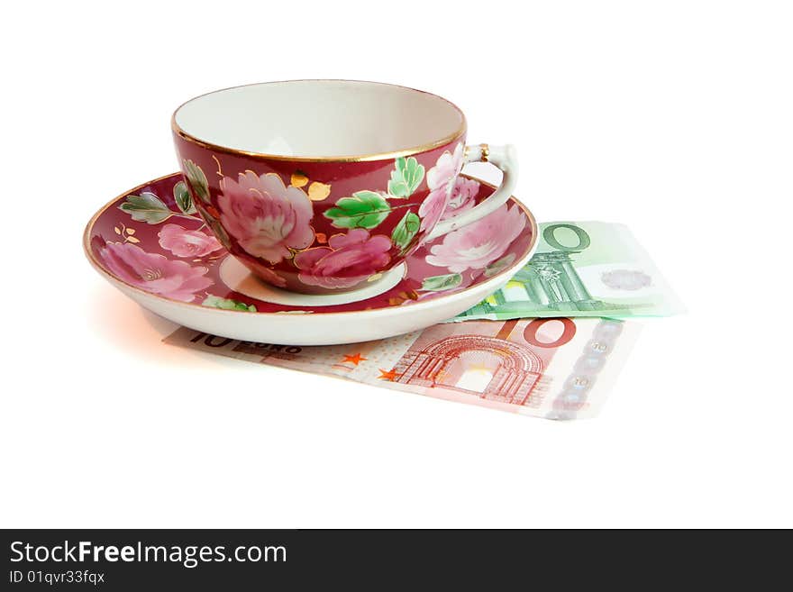 Tea service on euro money isolated