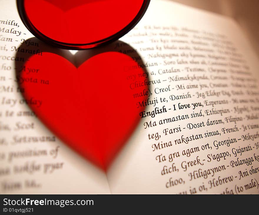 Lens shows a heart-shaped shadow on a book