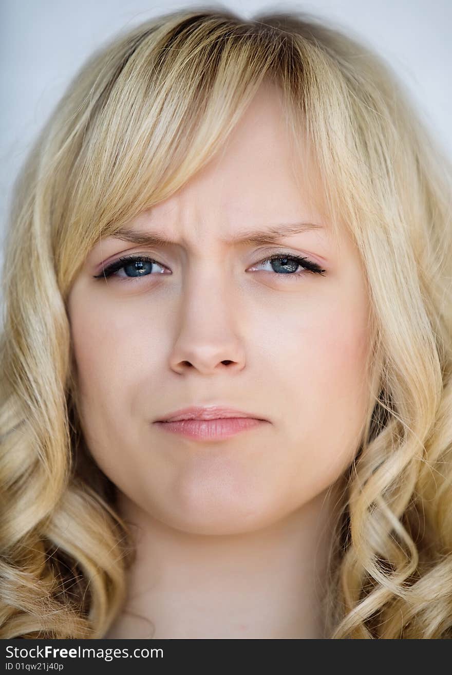 Portrait of the angry girl with light hair. Portrait of the angry girl with light hair