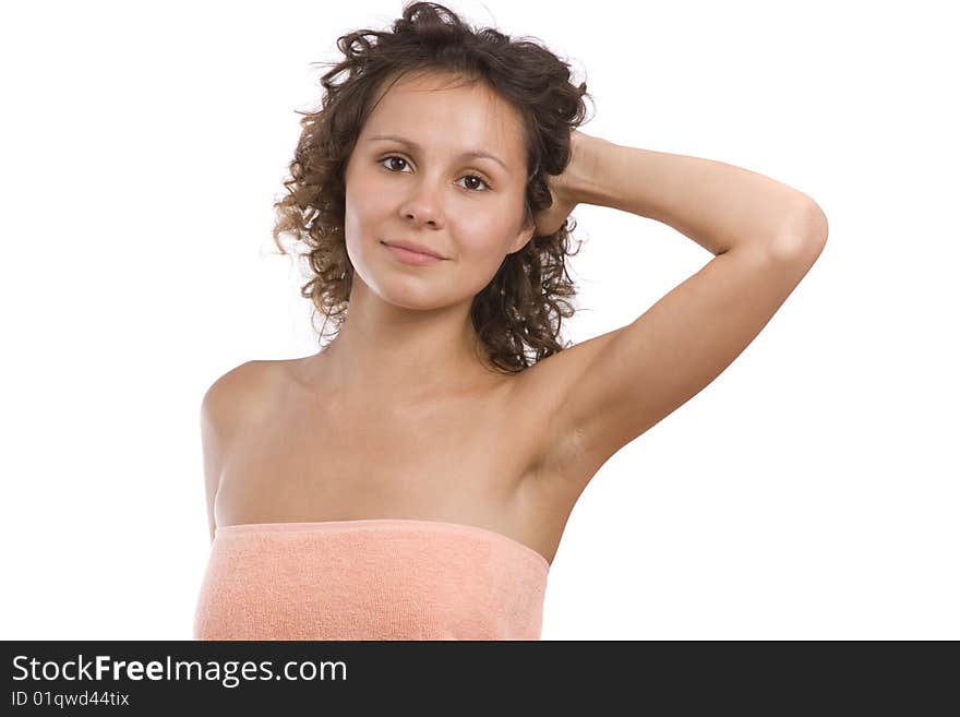 Woman wrapped in a peach-coloured bath towel. girl wearing towel. Isolated on a white background in studio. Young Woman in Bath series Girl in the towel after massage, spa and wellbeing concept. Woman wrapped in a peach-coloured bath towel. girl wearing towel. Isolated on a white background in studio. Young Woman in Bath series Girl in the towel after massage, spa and wellbeing concept.