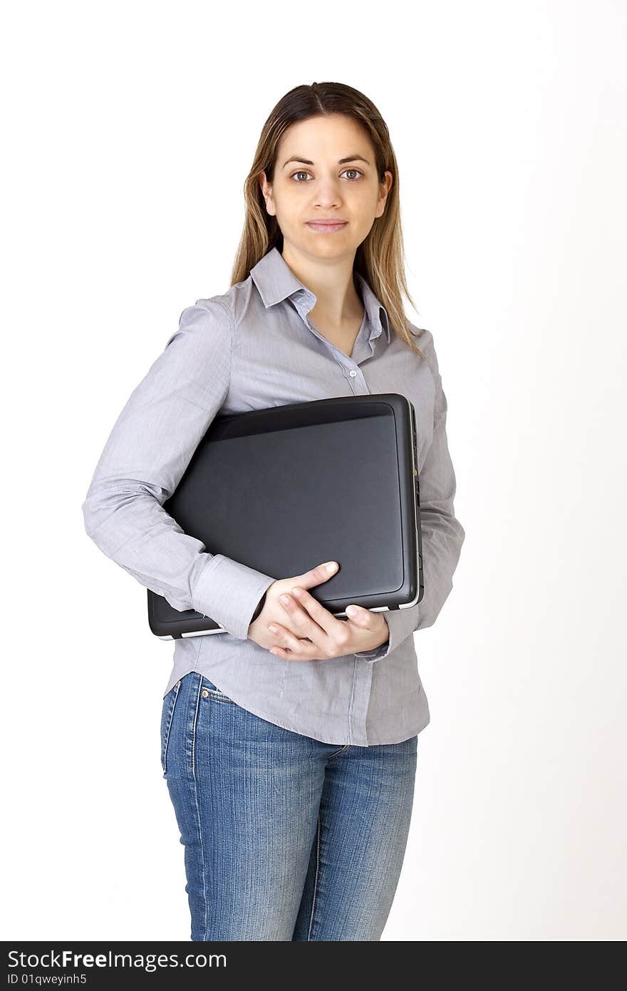 Young girl, writes in her computer. Young girl, writes in her computer