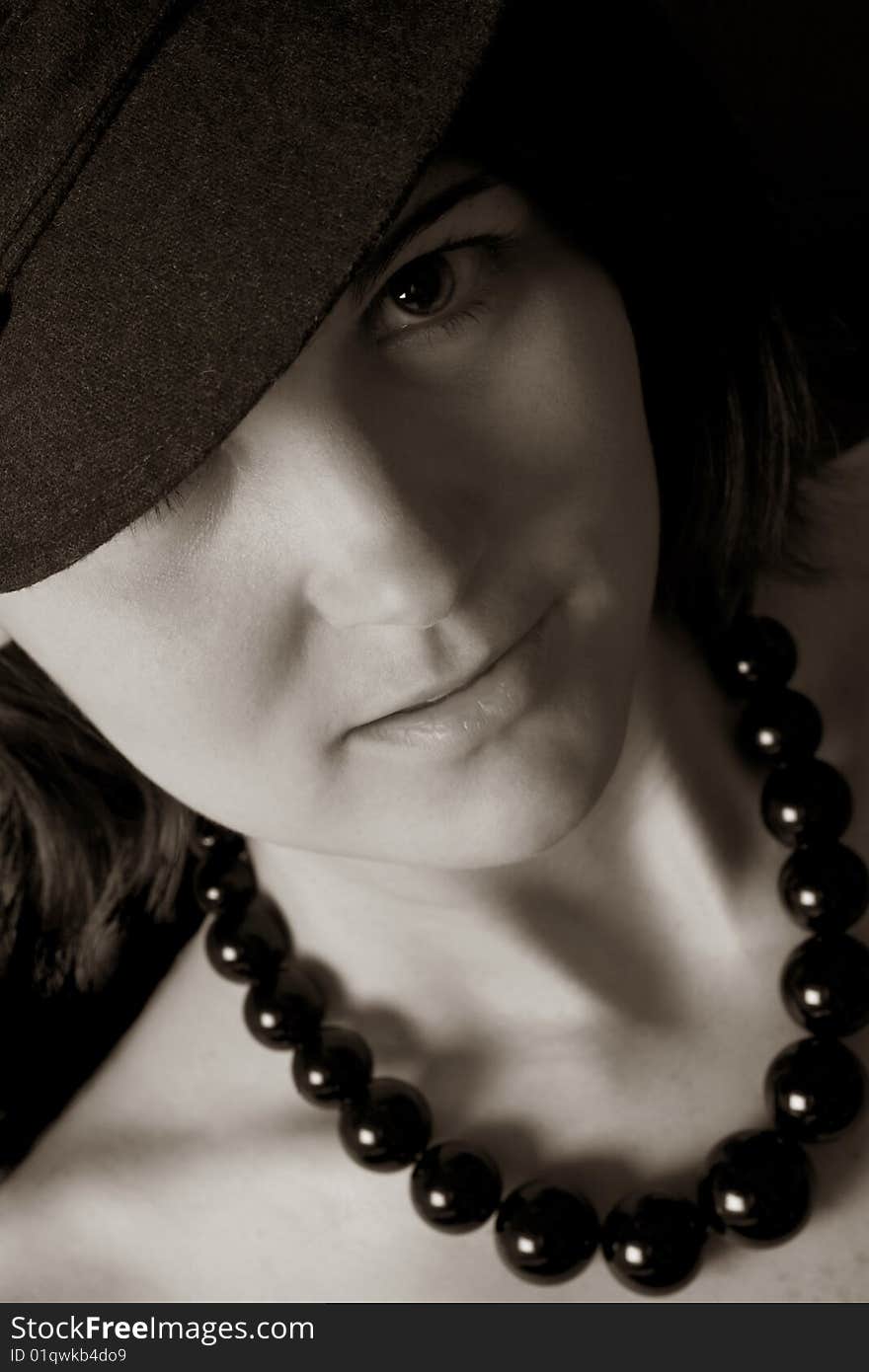 Beautiful black and white  image of an attractive woman wearing a chunky black necklace. Beautiful black and white  image of an attractive woman wearing a chunky black necklace.