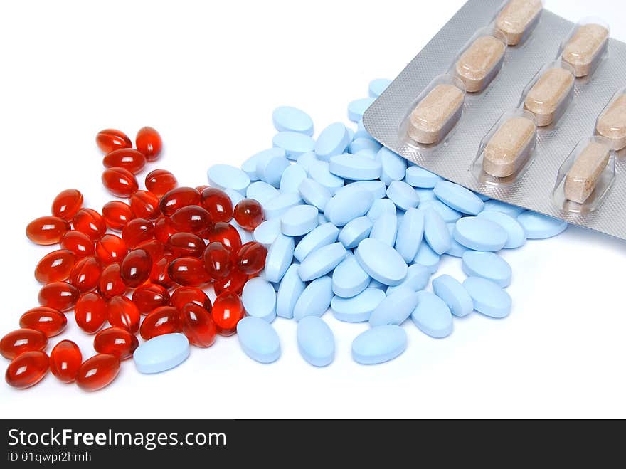 Colorful pills on white background