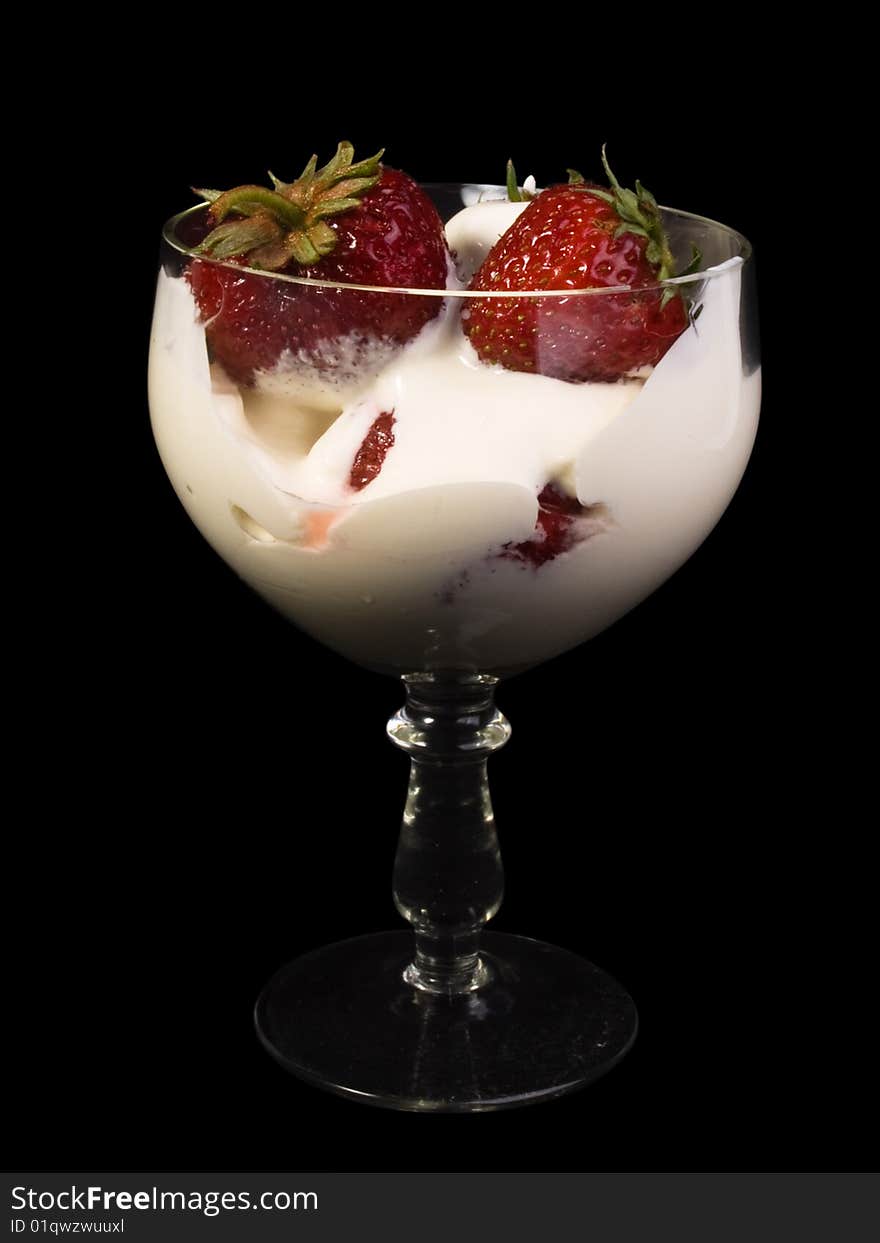 Fresh strawberry with plums in  glass  on a black background. Fresh strawberry with plums in  glass  on a black background