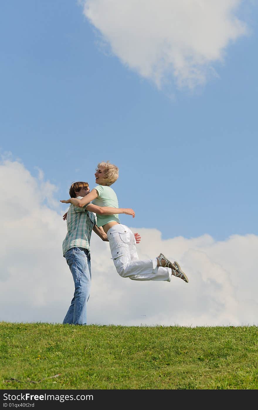 Pretty young couple is jumping