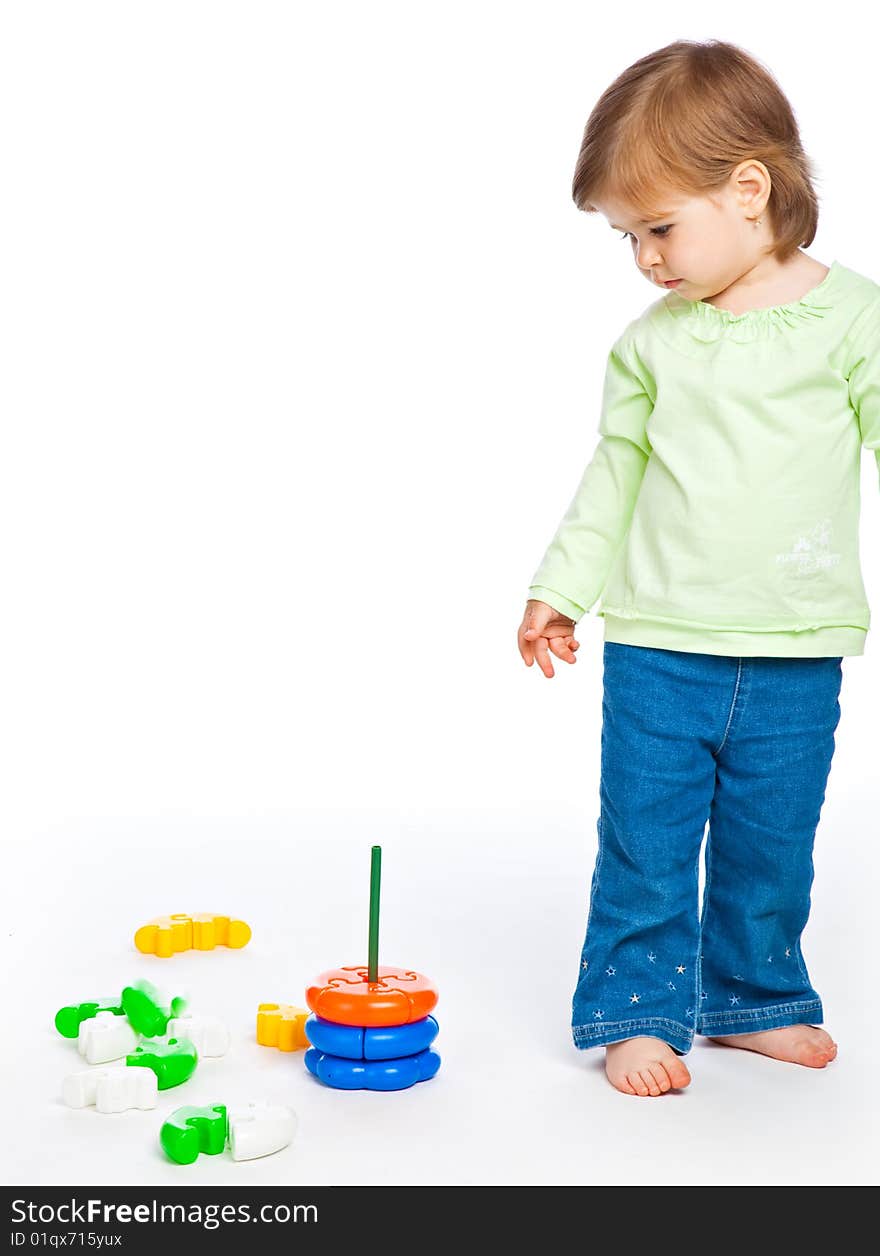 Little girl with toys. Isolated on white background