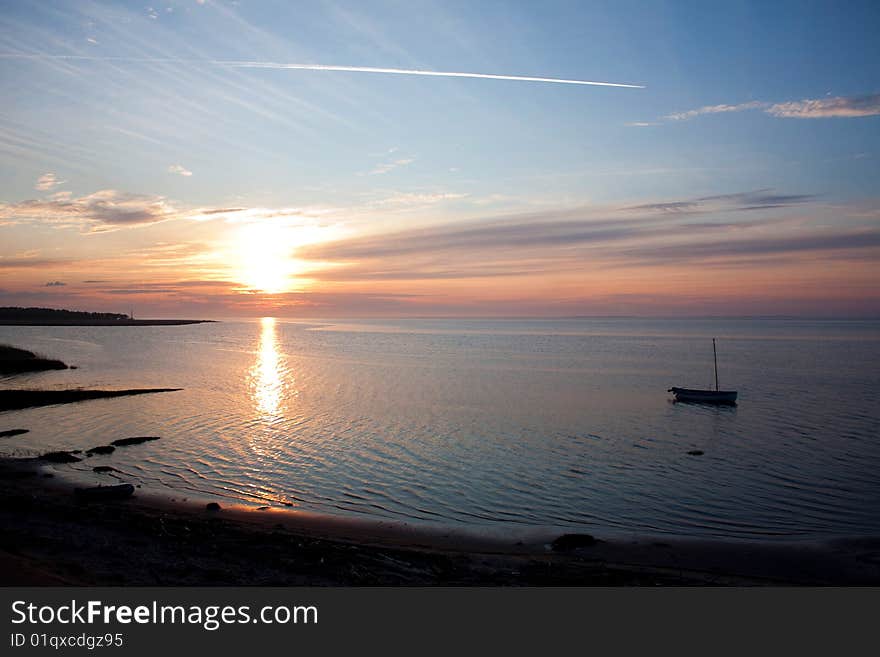 Yacht on an anchor on a background of the coming s