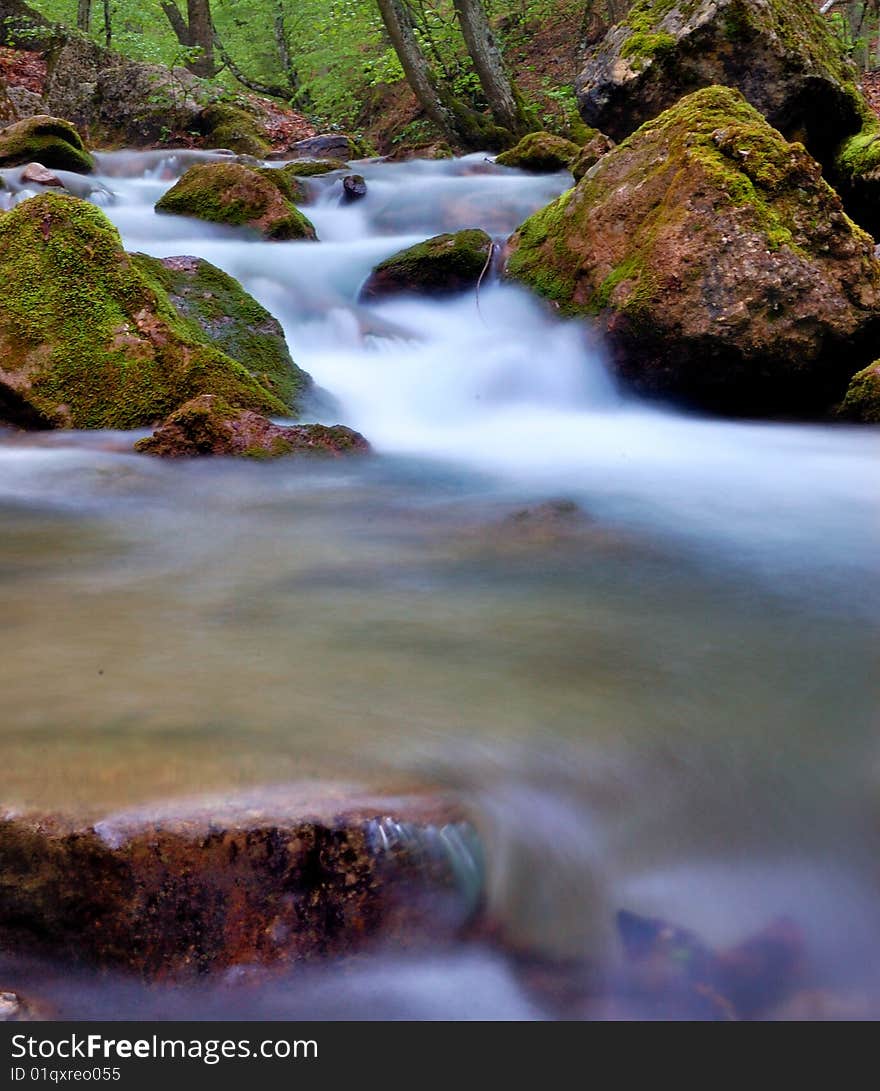 Endless mountain river carries its water. Endless mountain river carries its water