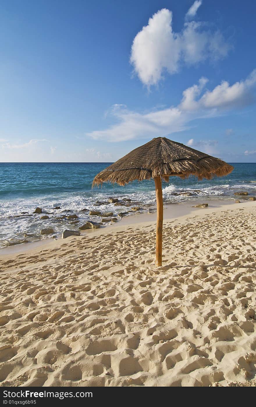 Palapa along a stretch of empty Caribbean beach. Palapa along a stretch of empty Caribbean beach