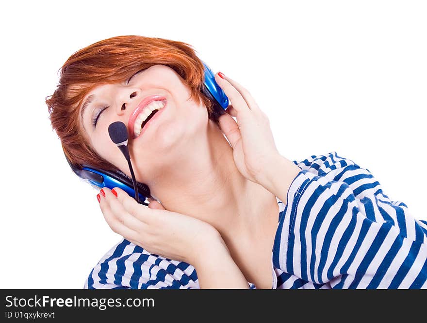 Beautiful blue-eyed girl with headphones on laughing. Beautiful blue-eyed girl with headphones on laughing