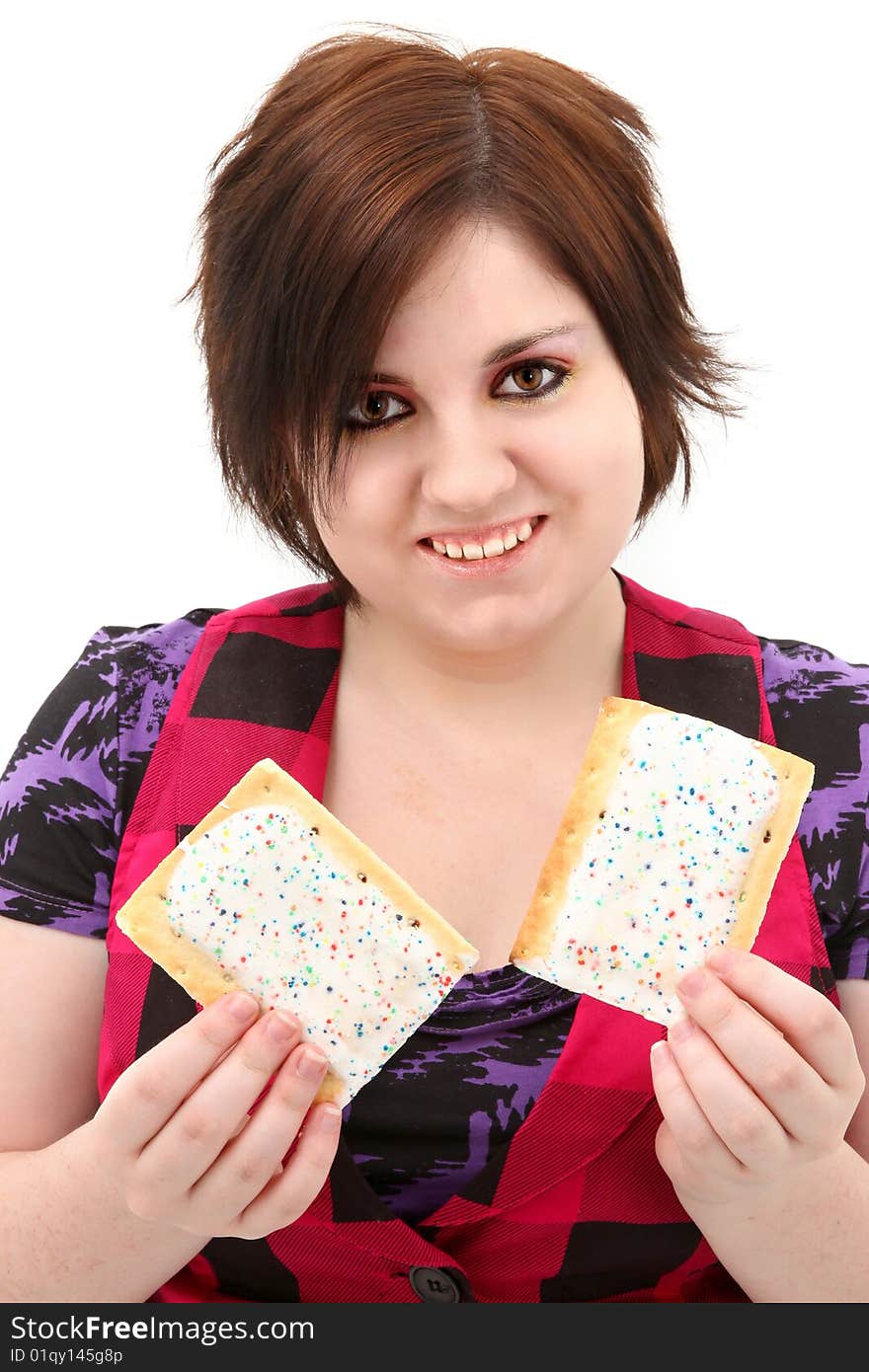 Beautiful seventeen year old teen girl holding two toaster pastries. Beautiful seventeen year old teen girl holding two toaster pastries.