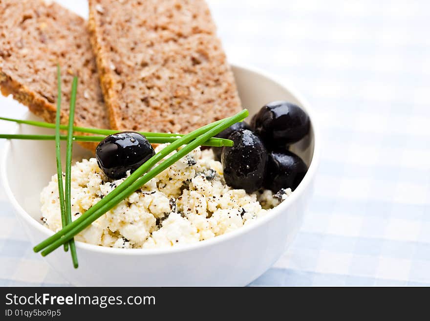 Delicious meal of feta cheese, bread and black olives. Delicious meal of feta cheese, bread and black olives