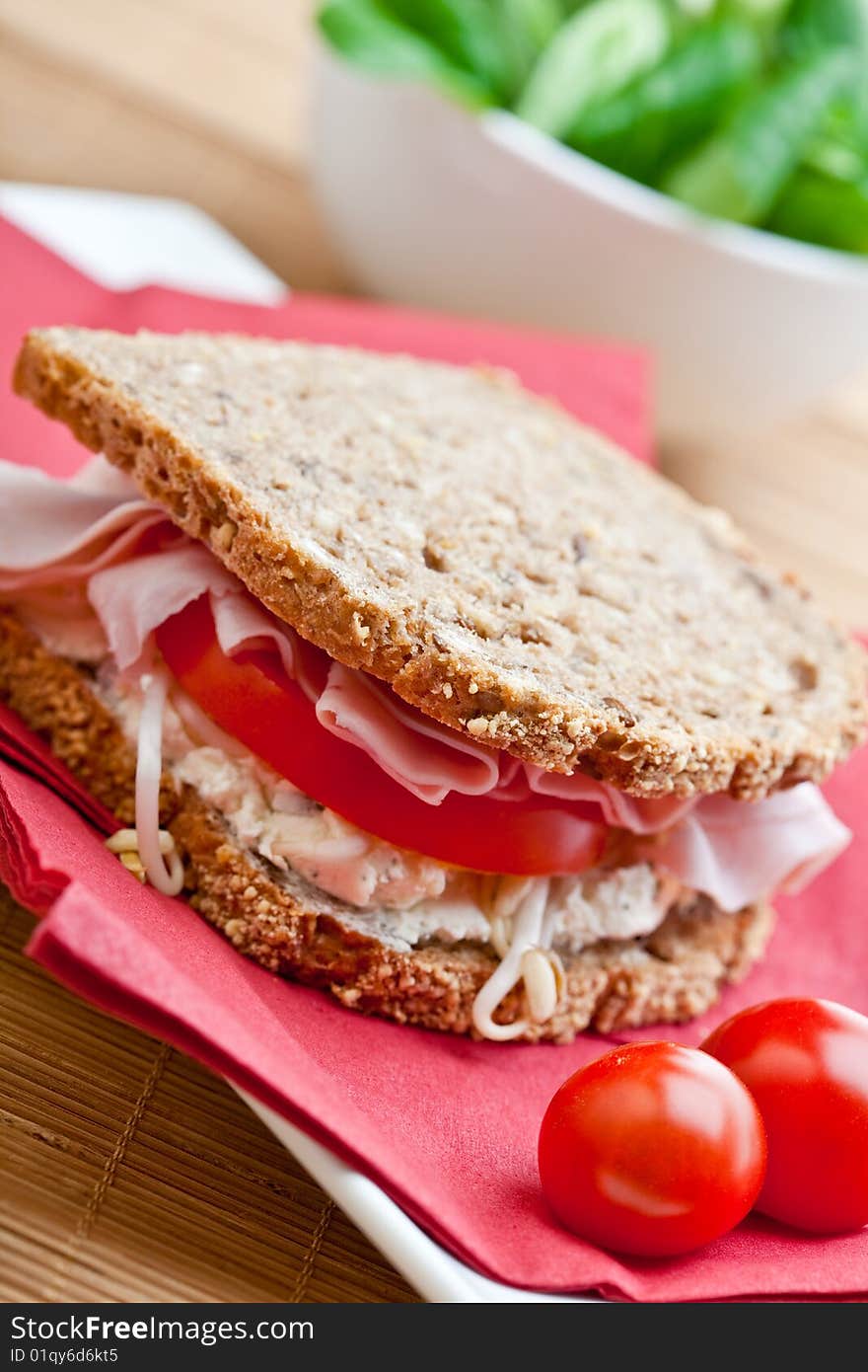 Healthy ham, cheese and tomato sandwich with bean sprouts