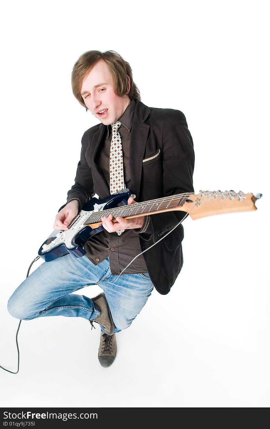 Crazy man playing electro guitar, high angle view