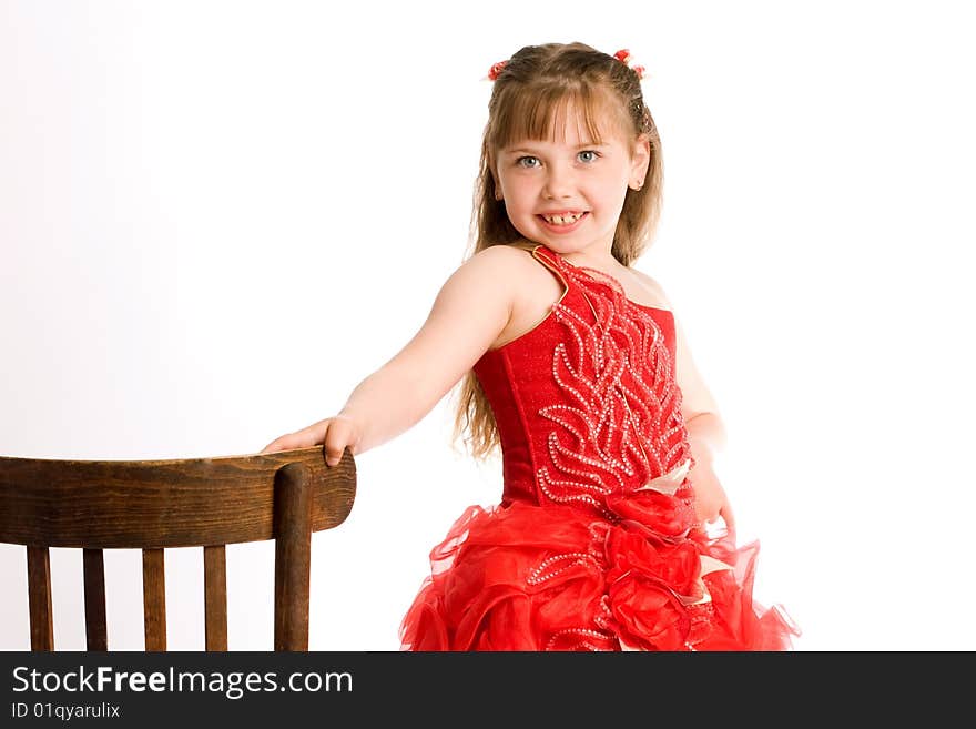 An image of a nice girl with brown chair. An image of a nice girl with brown chair