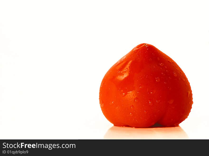 Fresh tomato with water drops