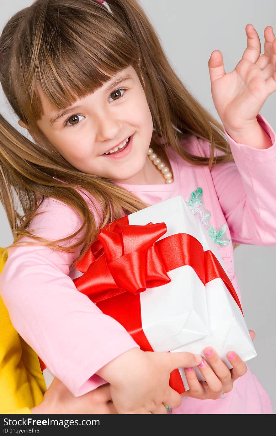 Little girl with white gift box