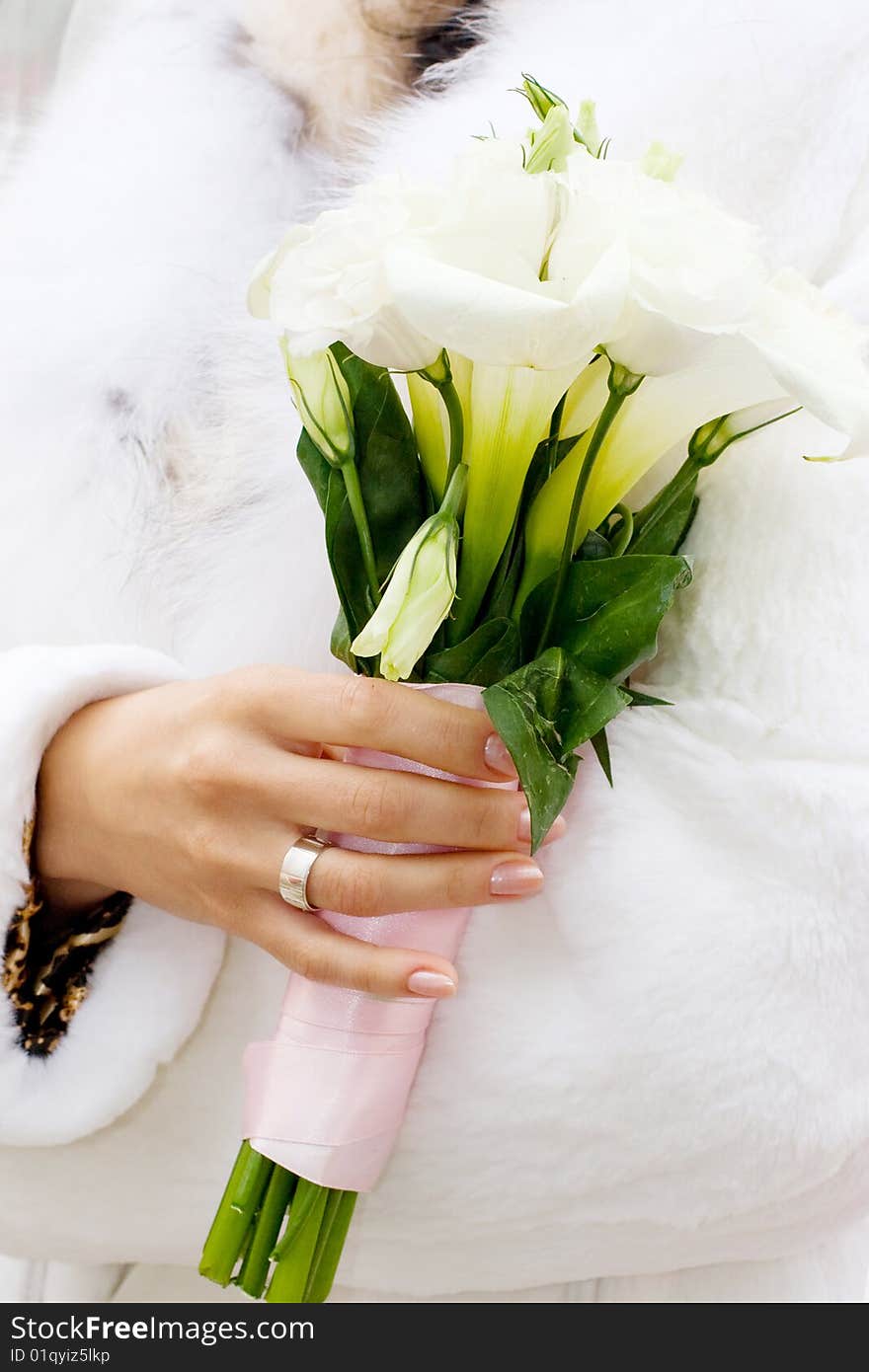 Closeup of bride with bouquet and ribbons. Closeup of bride with bouquet and ribbons