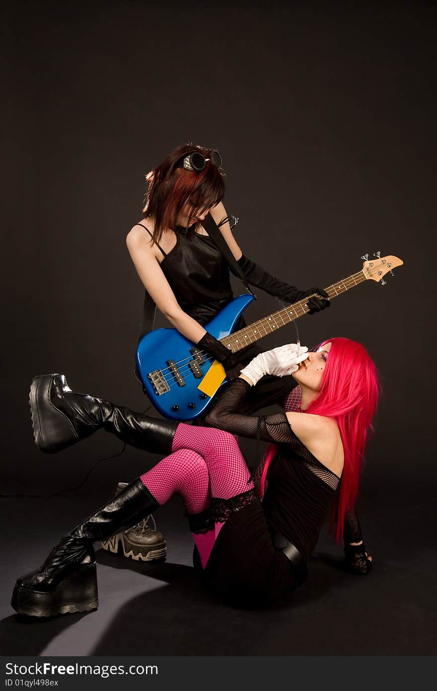 Sexy rock girls with bass guitar