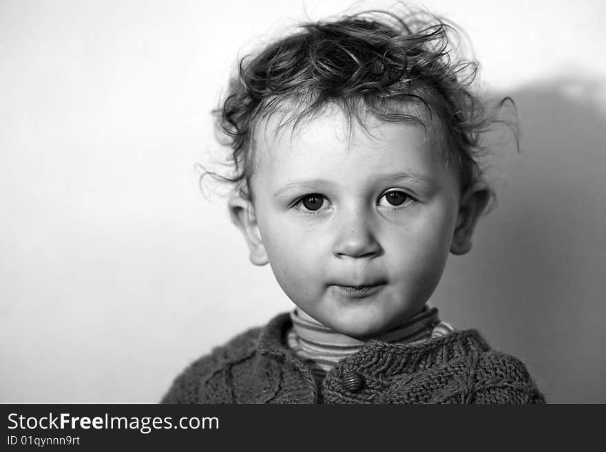 Assuming airs little boy with dishevelled hair before the camera