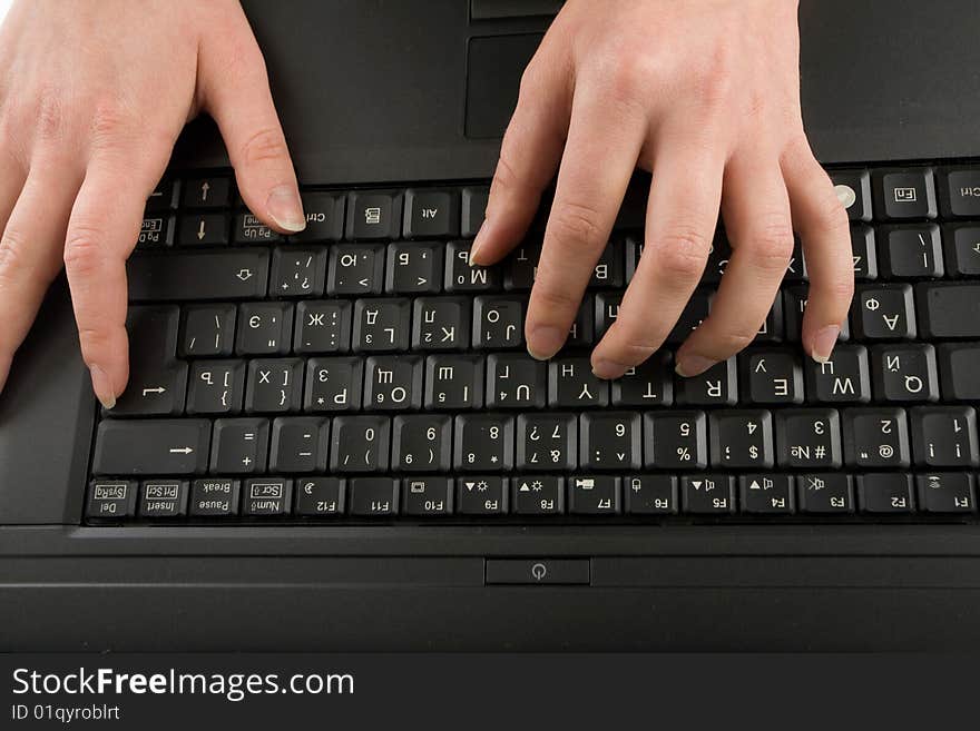 Close-up of female hands on the keyboard  typing documents. Close-up of female hands on the keyboard  typing documents