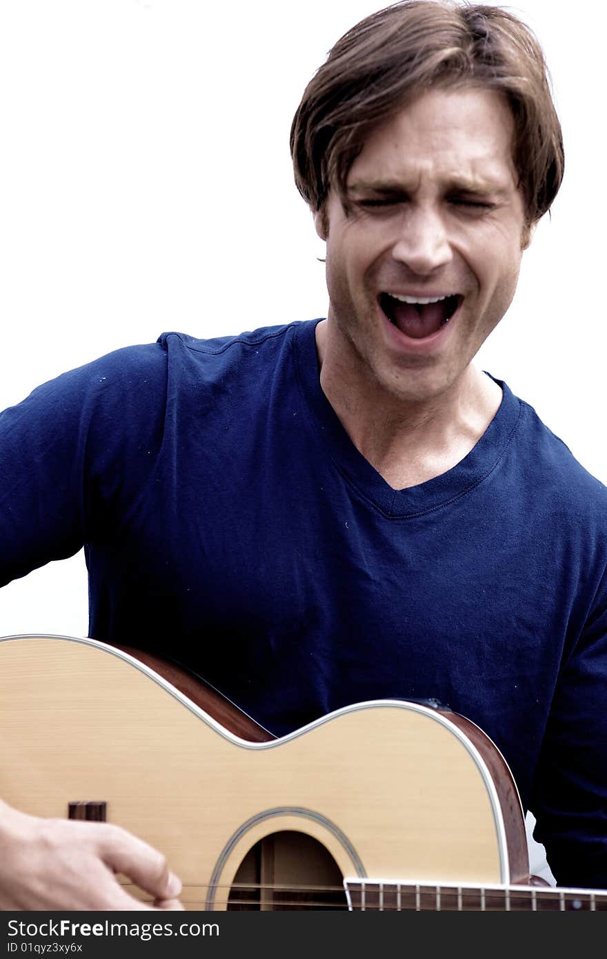 An attractive guitar player with a blue shirt and white background