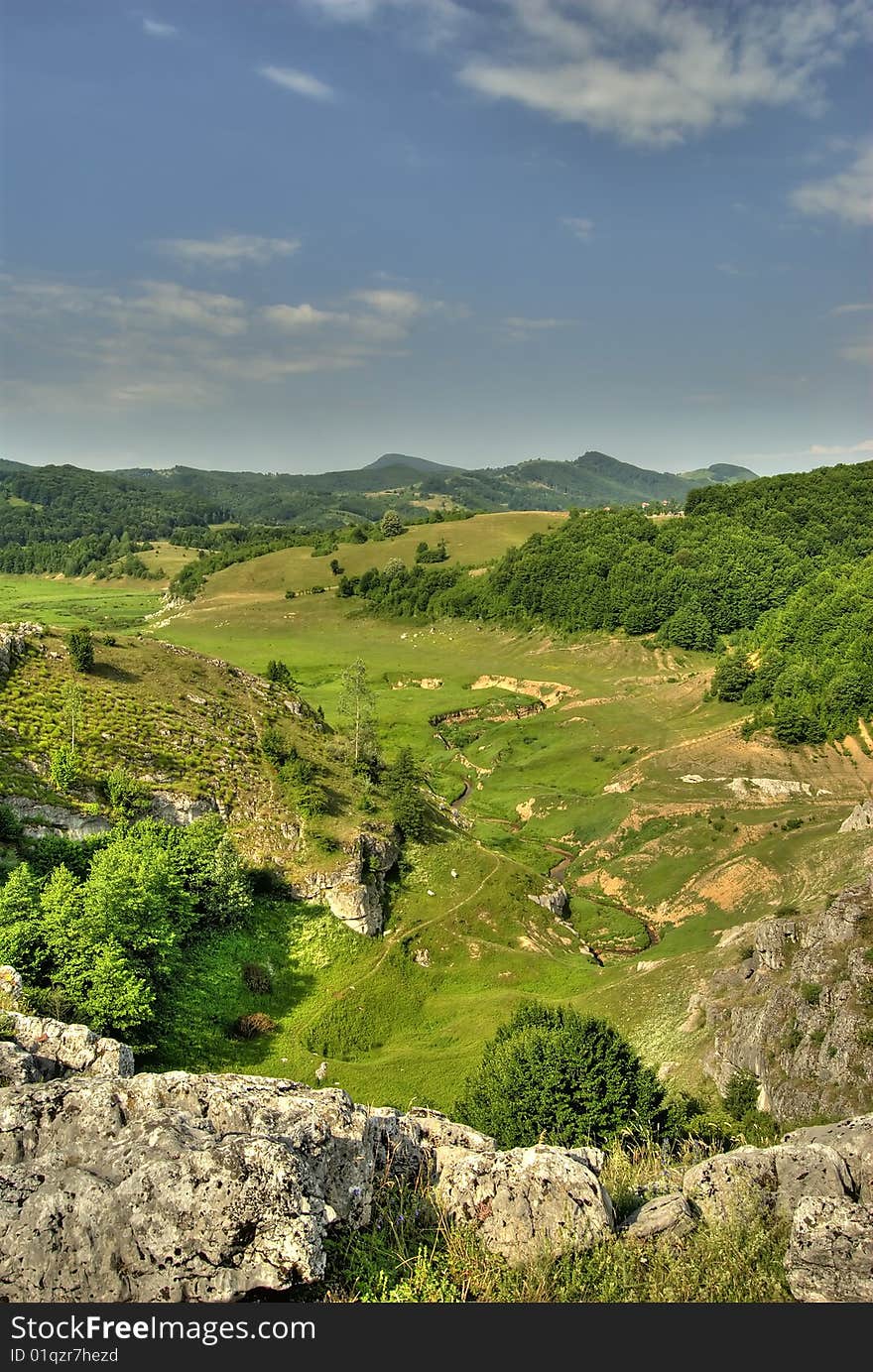 High view of a lush green valley. High view of a lush green valley