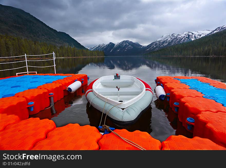 Boats on a mooring on mountain lake