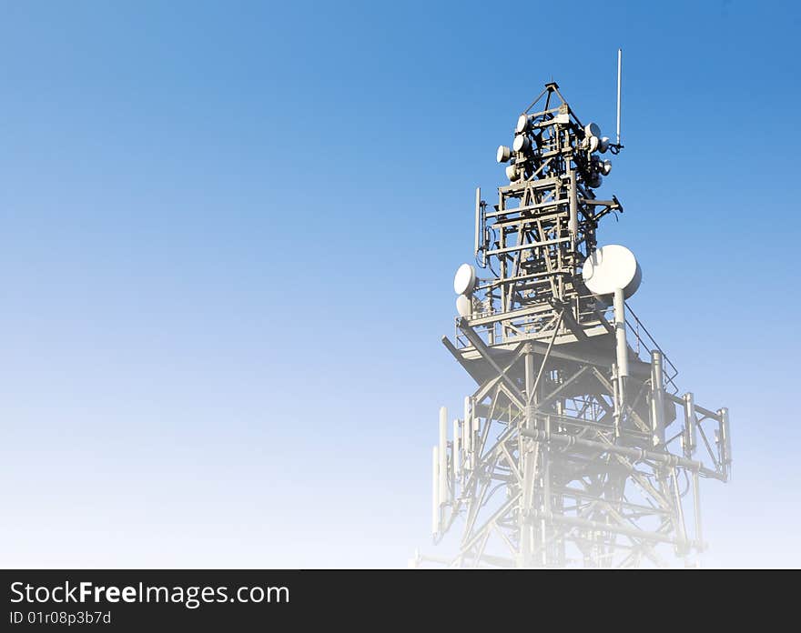 Communications concept showing mast overlaid with blue to white color. Communications concept showing mast overlaid with blue to white color