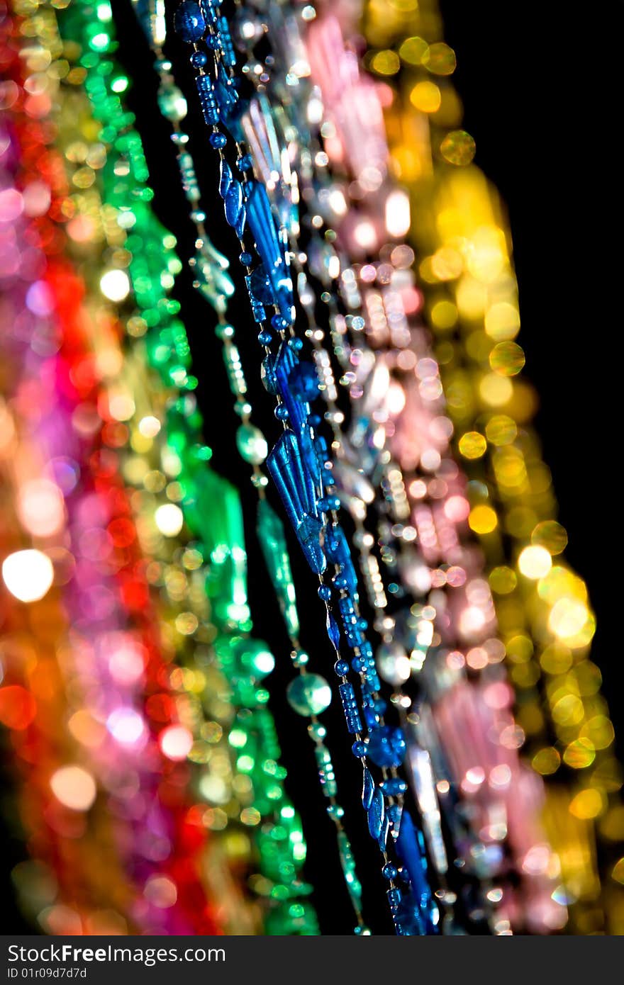 Colourful beads hanging in a doorway.