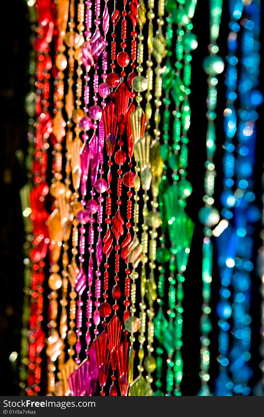 Colourful beads hanging in a doorway.