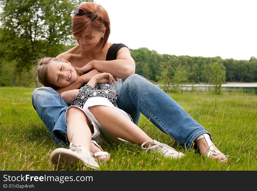 Mother and Daughter are happy in the park. Mother and Daughter are happy in the park