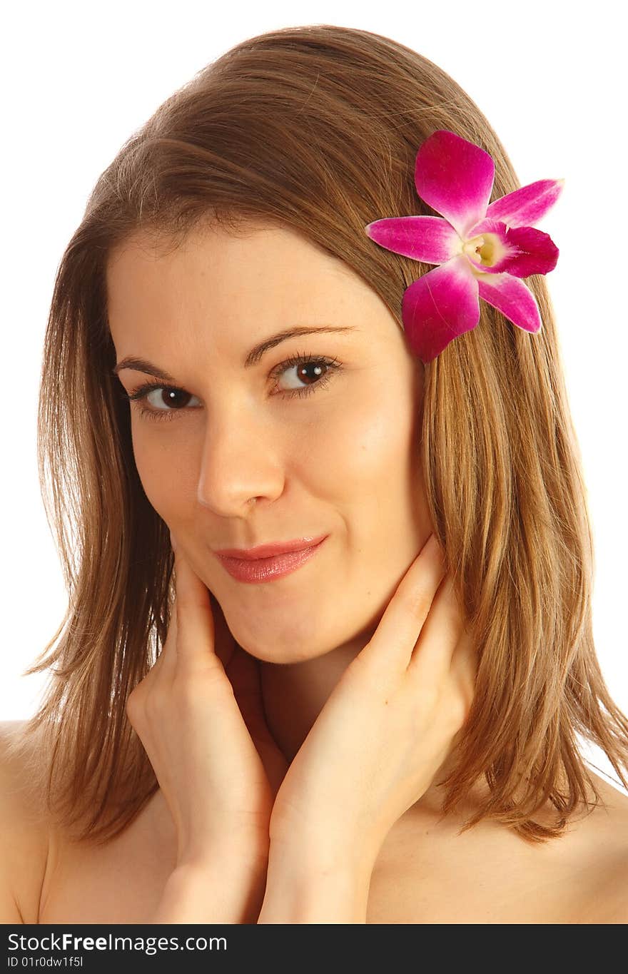 Beautiful girl with a flower in her hair. Isolated on white