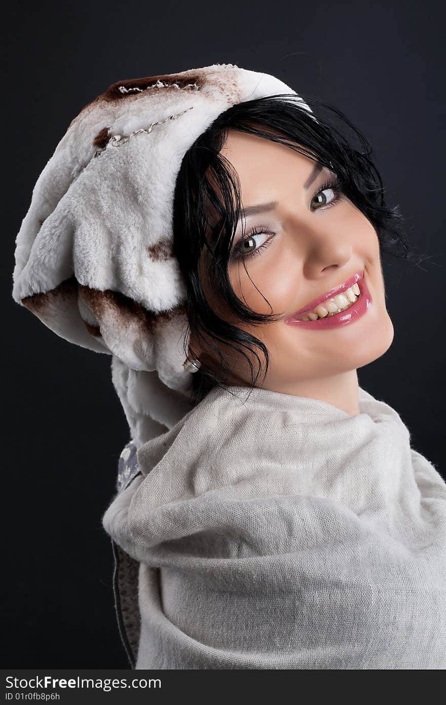 Young attractive woman in a fur hat