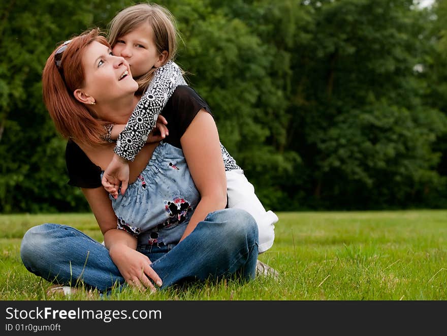 Mother and Daughter are happy in the park. Mother and Daughter are happy in the park