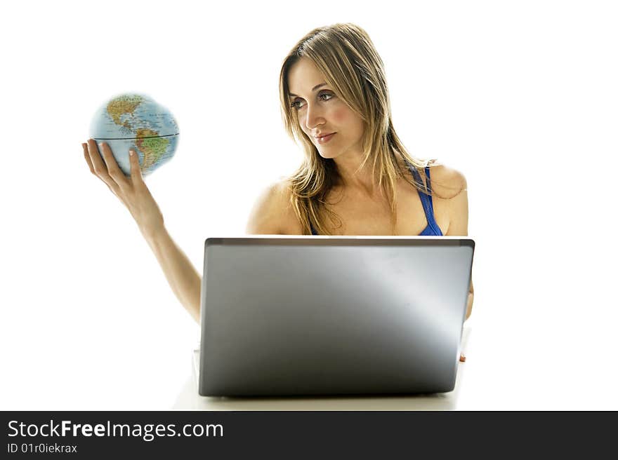 Young woman holding a small globe in her hand. Young woman holding a small globe in her hand.