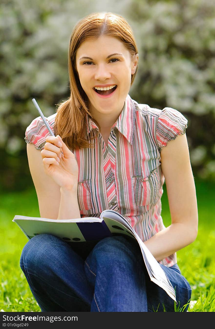 Pretty girl studying outdoors