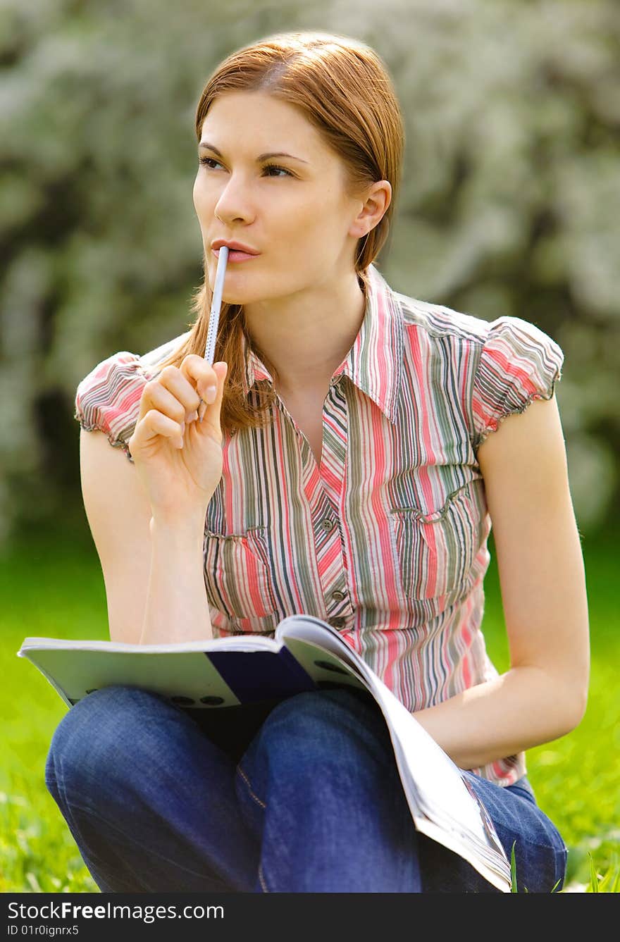 Pretty Girl Studying Outdoors