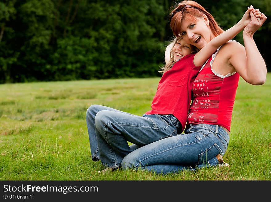 Mother and Daughter are happy in the park. Mother and Daughter are happy in the park