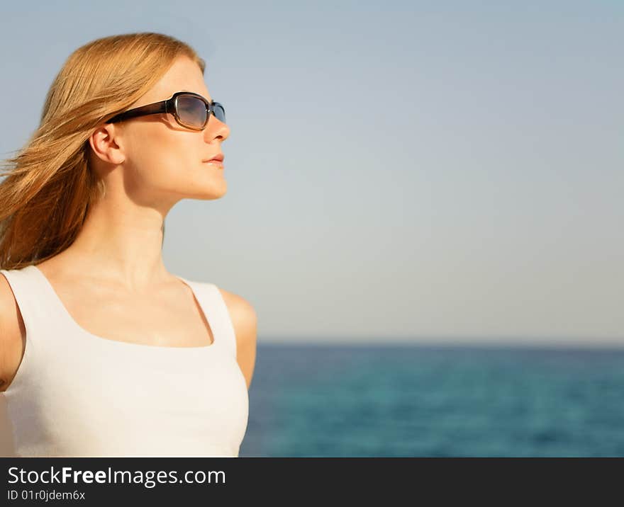 Beautiful Young Woman On The Beach