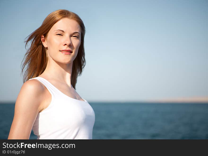 Beautiful young woman on the beach