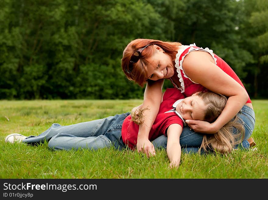 Mother and Daughter are happy in the park. Mother and Daughter are happy in the park