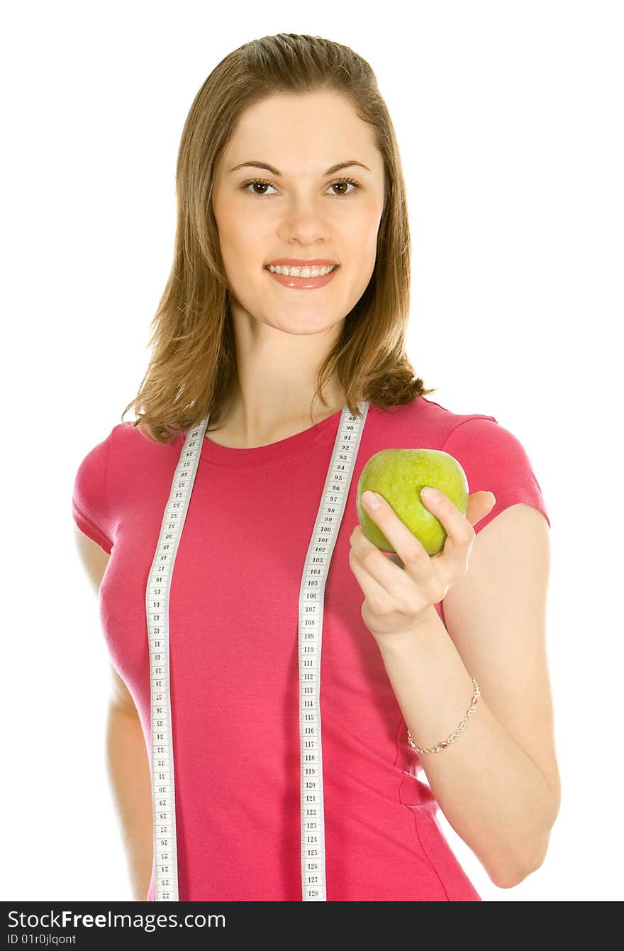 Beautiful girl holding an apple and a measure tape