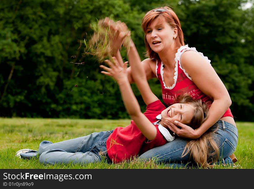 Mother and Daughter are happy in the park. Mother and Daughter are happy in the park