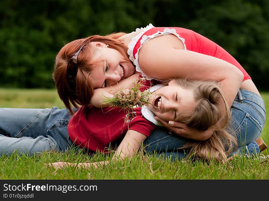 Mother and Daughter are happy in the park. Mother and Daughter are happy in the park