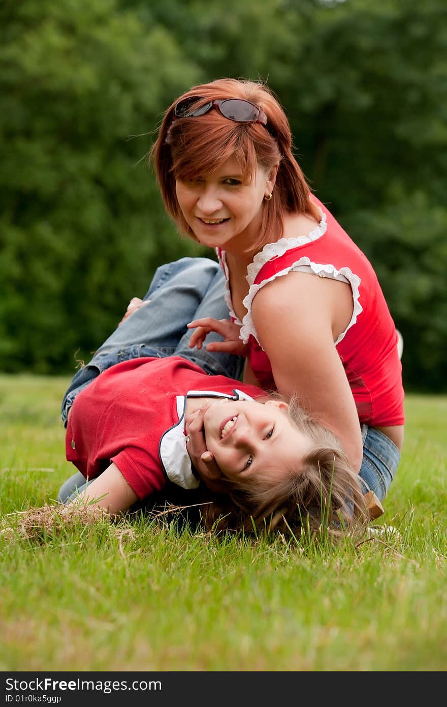 Mother and Daughter are happy in the park. Mother and Daughter are happy in the park