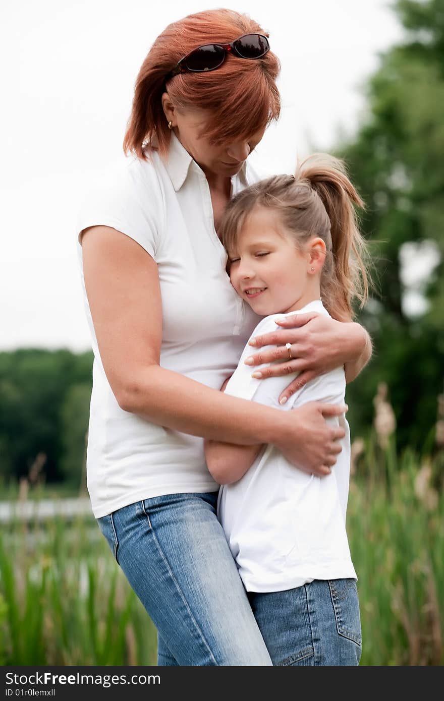 Mother and Daughter are happy in the park. Mother and Daughter are happy in the park