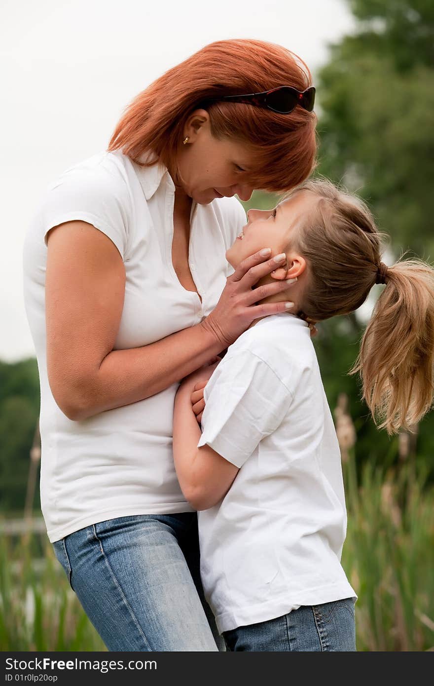 Mother and Daughter are happy in the park. Mother and Daughter are happy in the park